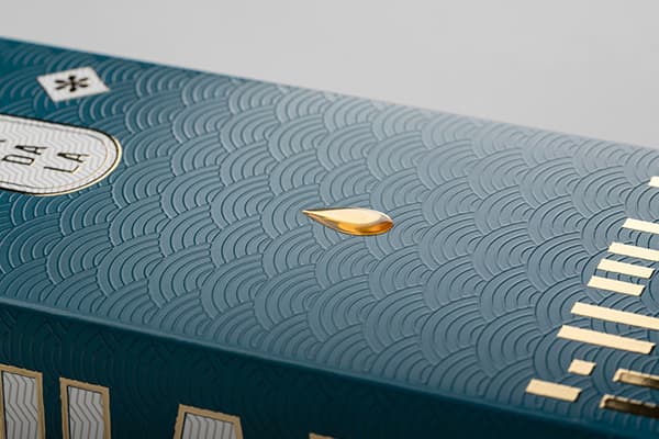 Close up on special finishes of the Chakra Booster box