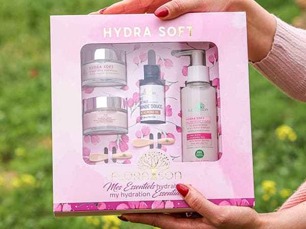 Rollover hinged lid box with window and cutouts for cosmetics